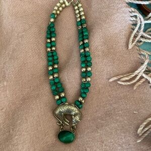 Malachite leopard necklace with silver beads.